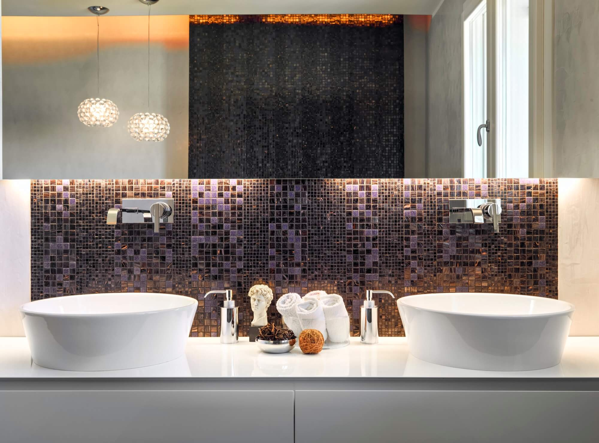 Stylish bathroom with double overhead sinks, wall-mounted faucets and mosaic tiles - bathroom renovation in modern style.